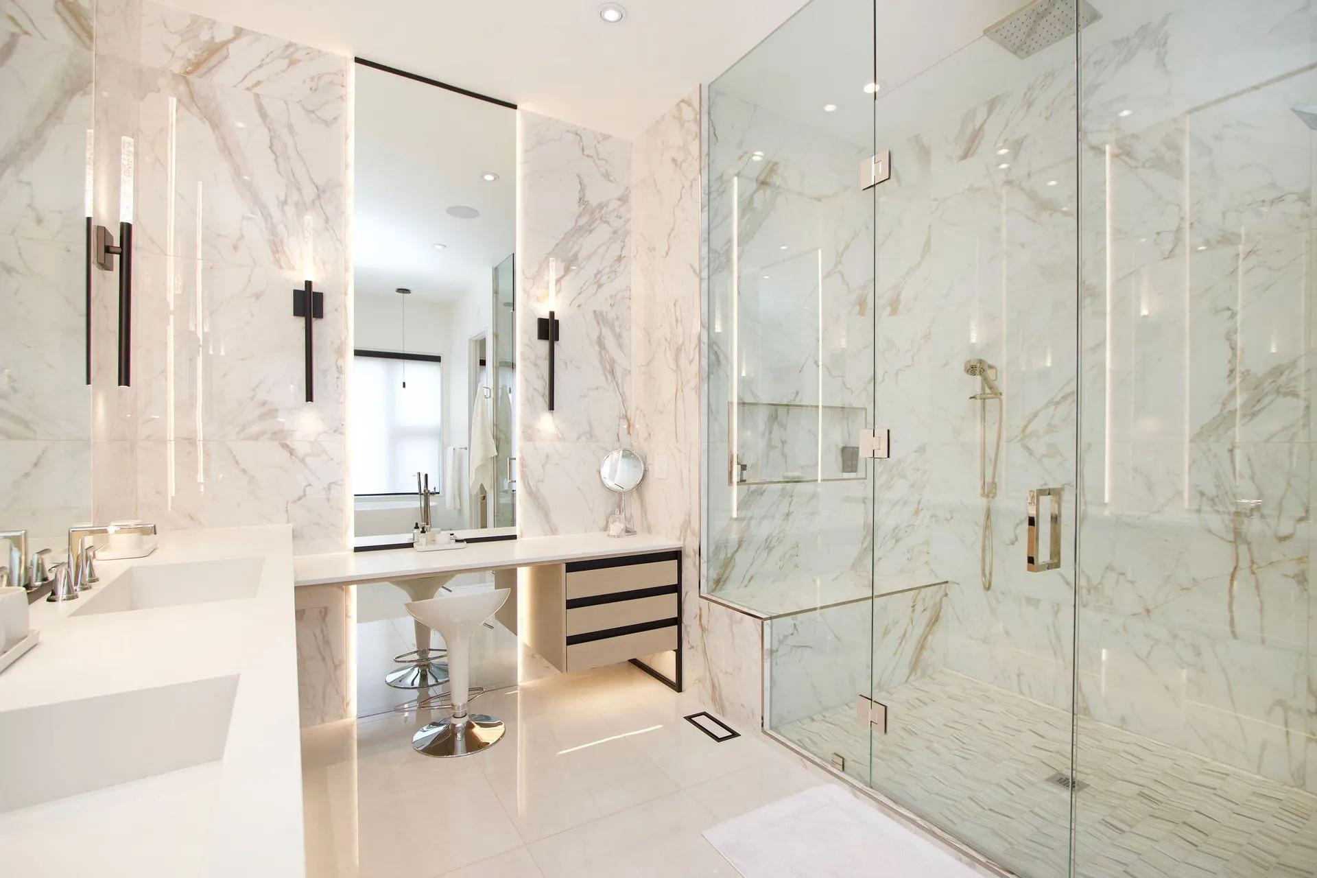 Complete renovated bathroom with glass shower, vanity and bright finishes